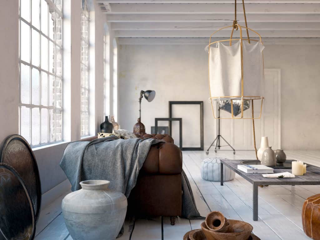 Bauen mit Lehm: Loft mit Holzdielen, Lehmwänden und Ledersofa.